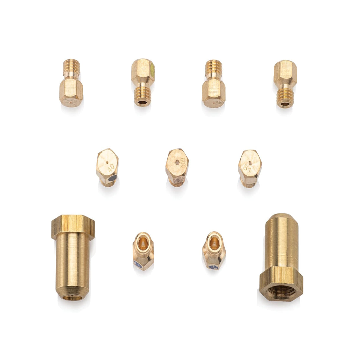A set of brass 3D printer nozzle tips and adapter fittings arranged on a clean white background.