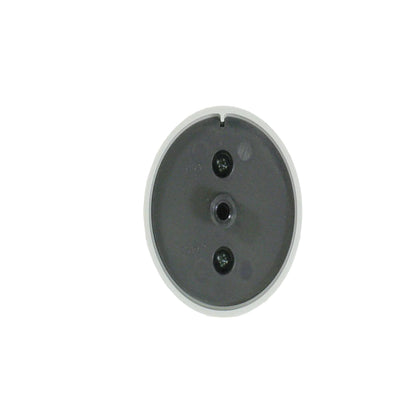 Round metallic component on a grid background