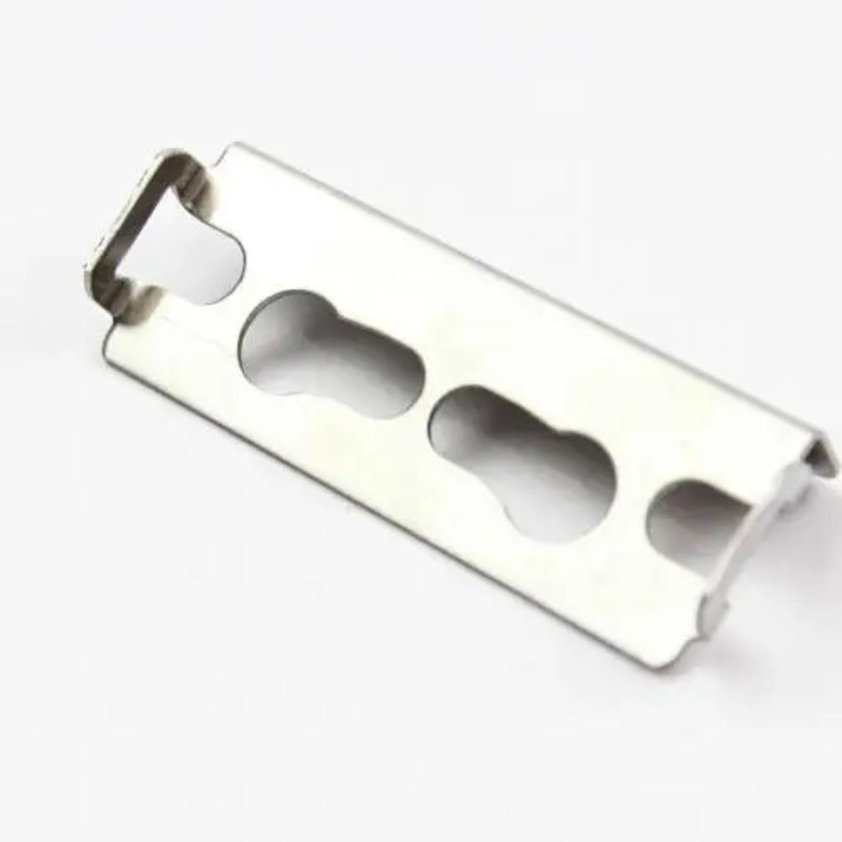 Metallic bottle opener on a white background