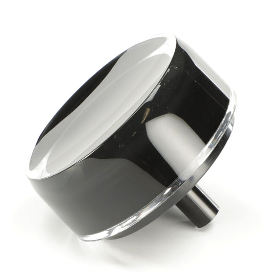 Black and silver knob on a white background