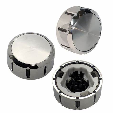 Three metallic knobs on a white background