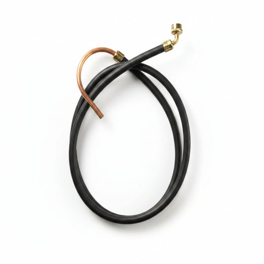 Black rubber hose with brass fitting on a grid background