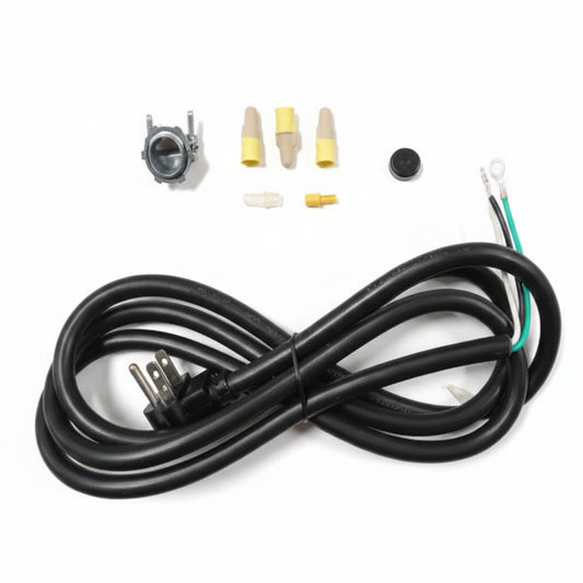 A black power cord with a three-prong plug, three beige wire connectors with yellow tips, and a small metal ring component, laid out on a white grid background.