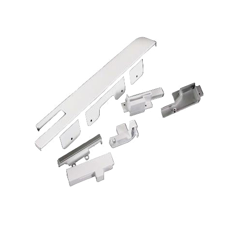 Set of white plastic components on a black background