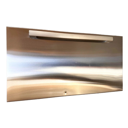 Stainless steel refrigerator door against a white wall